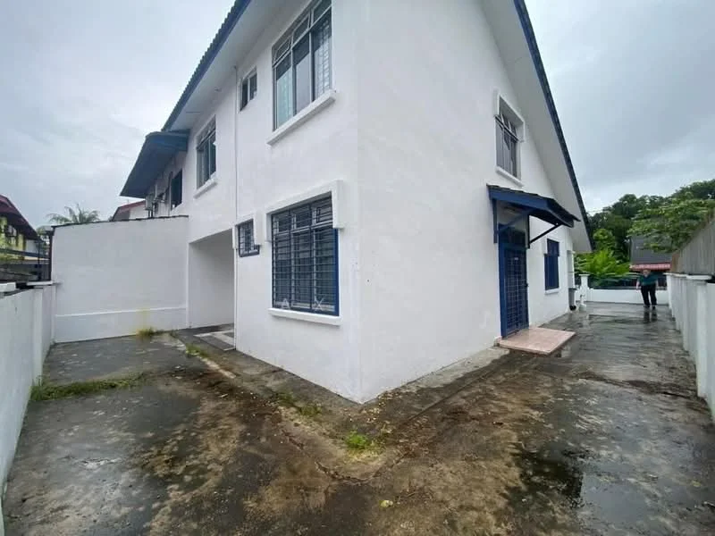 Exterior type: detached bungalow; features: white painted facade, flat roof, two-storey building, concrete pathway, windows with metal grills, surrounding walls, driveway, landscaped area, gated entry; style: modern.