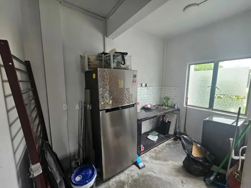 Kitchen features: stainless-steel fridge, black countertop, white tiled backsplash, sink, window with frosted glass, exposed concrete flooring, kitchen cabinets, cleaning supplies, garbage bags, broom, mop; view: garden.
