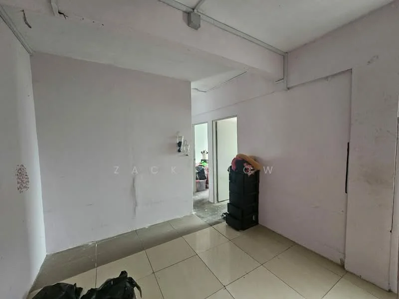Room features: light grey painted walls, white ceiling, tile flooring, doorway leading to another room, stacked boxes, unfurnished space.