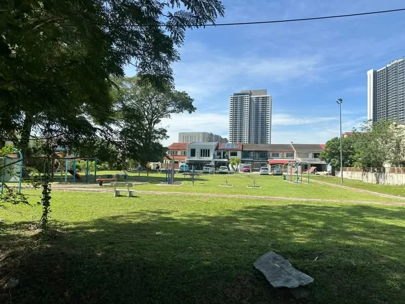 Exterior features: manicured lawn, mature trees, children's playground, park benches, surrounding high-rise buildings, clear blue sky; style: modern.
