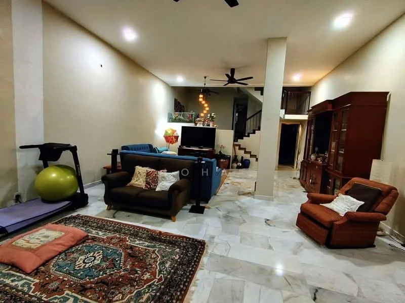 Living features: marble flooring, cream painted walls, 5-blade ceiling fan, sofa in brown fabric, sofa in blue fabric, armchair in orange fabric, coffee table, area rug with geometric pattern, TV console, decorative wall unit, exercise ball, treadmill, staircase in background; style: modern.