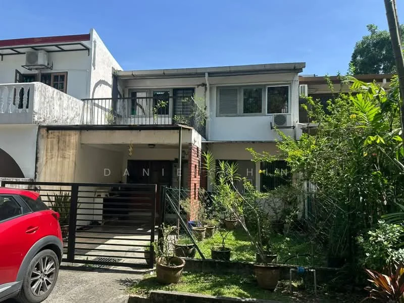 Exterior type: semi-detached house; features: two-storey structure, red brick facade, white painted facade, balcony on upper level, manicured lawn, potted plants in front, car porch with gate, air conditioning unit visible, surrounded by greenery; style: modern.