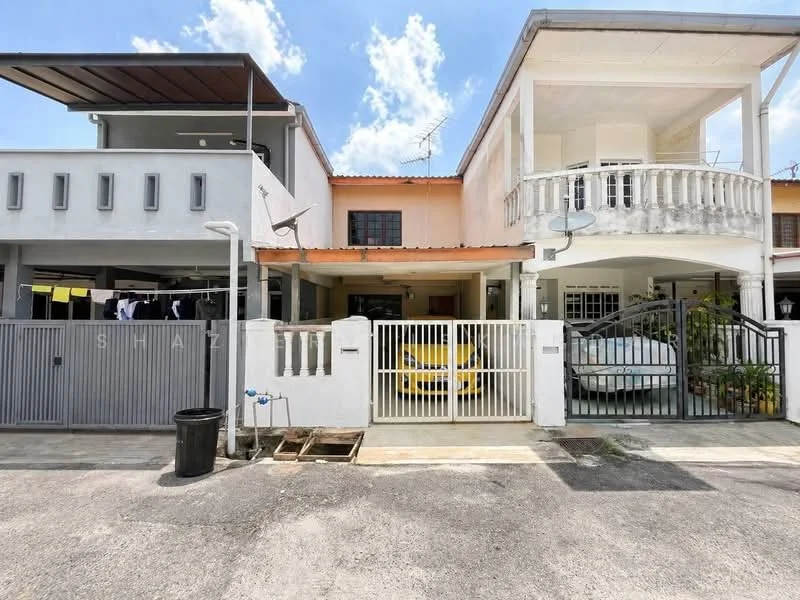 Exterior type: linked terrace house; features: white painted facade, balcony with railing, two-storey structure, driveway with interlocking pavers, covered car porch, visible parking spaces, manicured landscaping, laundry area with clothesline, security gate, front yard with plants; style: modern.