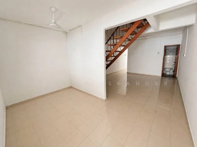 Room features: white painted walls, cream tiled flooring, ceiling fan, staircase with wooden steps, open layout, natural light from windows, no visible furniture, neutral color scheme; style: minimalist.