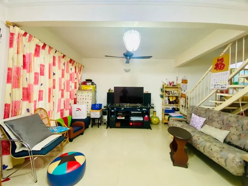 Living features: cream painted walls, white ceiling, 5-blade ceiling fan, wall-mounted TV, TV console, sofa with floral pattern, coffee table, area rug with geometric pattern, decorative wall clock, curtains with red and cream pattern, open shelving unit, rattan chair, colorful pouf; style: modern.