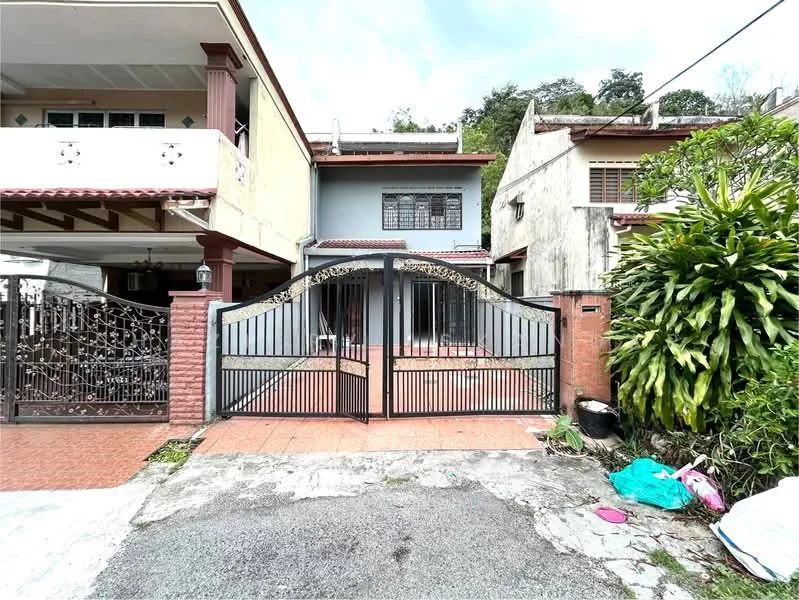 Exterior type: semi-detached house; features: gated entrance, brick facade, tiled walkway, manicured landscaping, potted plants, single-storey structure, metal gate with decorative design, front porch area; style: modern.