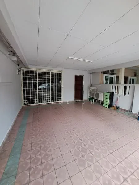 Room features: tiled flooring in pink, white painted walls, drop ceiling, security grille door, window with view to outside, wall-mounted air conditioning unit, green storage cabinets, light fixture on ceiling.
