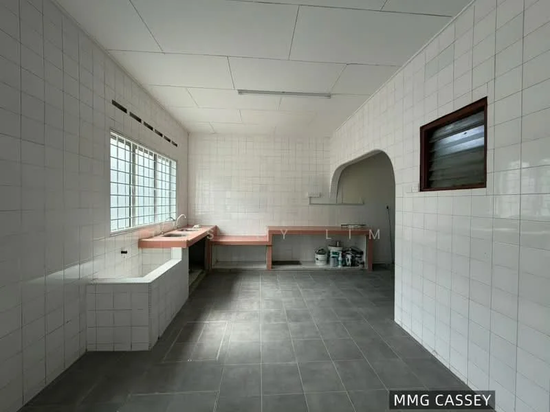 Kitchen features: white tiled walls, grey tiled flooring, single-bowl sink, wooden countertop, window with grid design, built-in shelving, open layout, arched entryway.