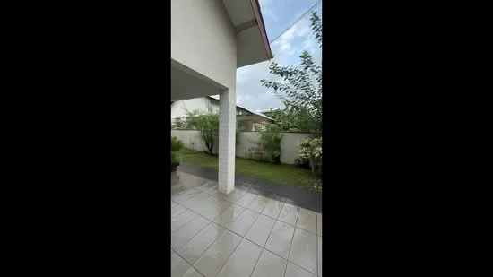 Exterior features: covered porch, tiled flooring, manicured lawn, garden area, fence, bushes, trees, cloudy sky; style: modern.