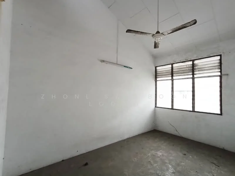 Room features: white painted walls, concrete flooring, sloped ceiling, ceiling fan, large window with multiple panes, natural light from window.