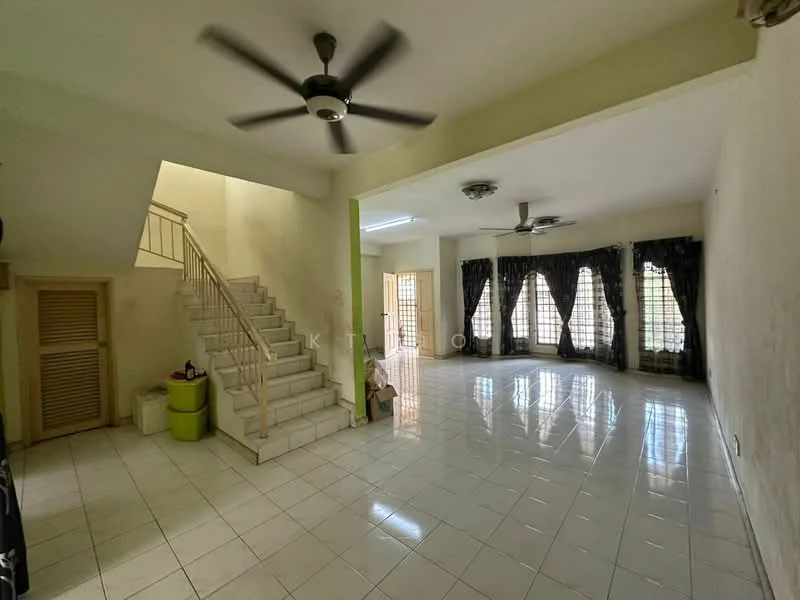 Living features: white tiled flooring, cream painted walls, 5-blade ceiling fan, 2 ceiling lights, large windows with black curtains, open layout, staircase leading to upper floor, green accent wall, decorative wall paneling, corner with storage bins; style: modern.