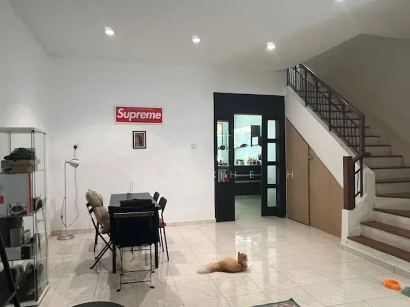 Living features: white painted walls, tile flooring, 5 recessed downlights, black dining table with 4 chairs, floor lamp, framed artwork, Supreme wall sign, open staircase, wooden handrail, cat on the floor; style: modern. Kitchen features: open kitchen layout, visible cabinetry, kitchen appliances, unknown countertop material.