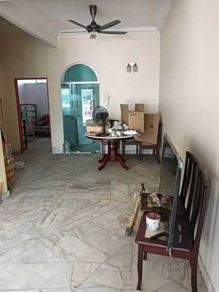Living features: marble flooring, cream painted walls, 5-blade ceiling fan, wooden dining table, 4 wooden chairs, TV console, wall-mounted TV, cardboard boxes, standing fan, decorative wall sconce, open doorway to balcony, glass door leading outside.