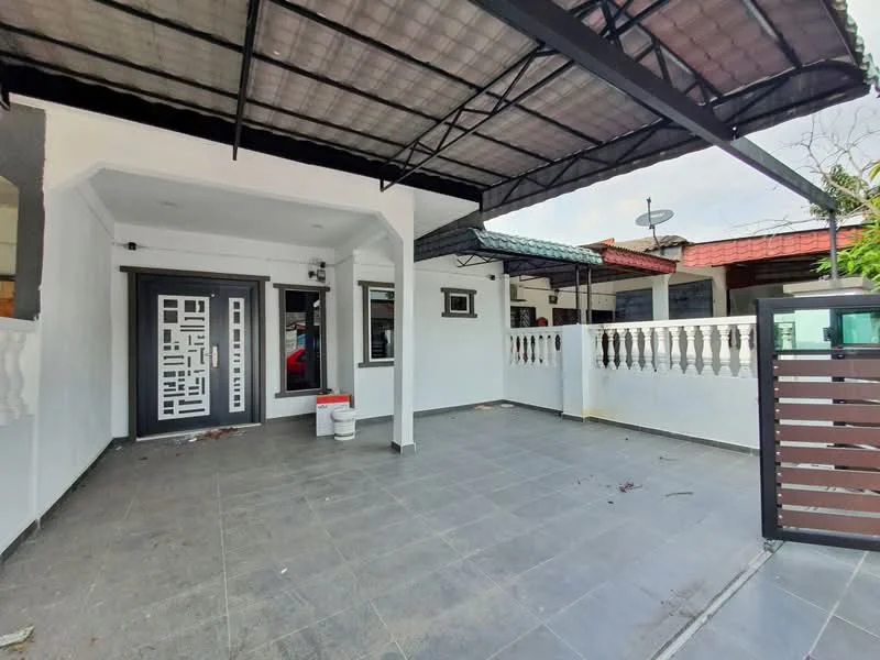 Exterior type: semi-detached house; features: covered porch area, grey tiled flooring, white painted walls, decorative front door with geometric design, metal gate, fence with vertical slats, overhead awning, visible neighboring houses, outdoor space with potential for landscaping; style: modern.