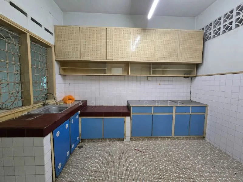 Kitchen features: single-bowl stainless-steel sink, chrome faucet, red countertop, blue cabinetry, open shelving, tile backsplash, mosaic tile flooring, window with security grill, wall-mounted cabinets, exposed brick wall; style: traditional.