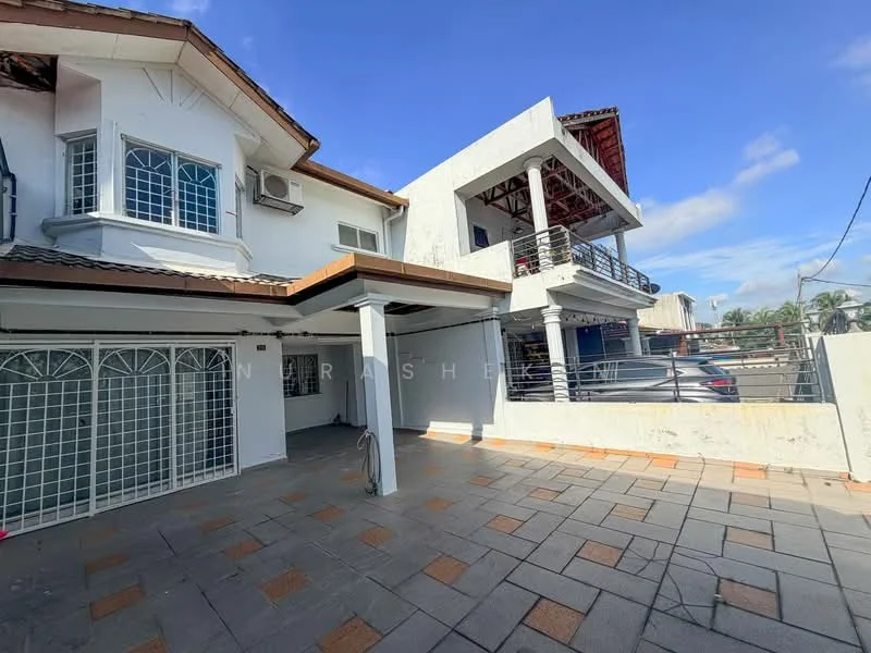 Exterior type: detached bungalow; features: white painted facade, flat roof, 2-storey structure, manicured lawn, paved driveway, balcony with railing, car parking area, large windows, gated entrance, outdoor terrace, surrounded by greenery; style: modern.