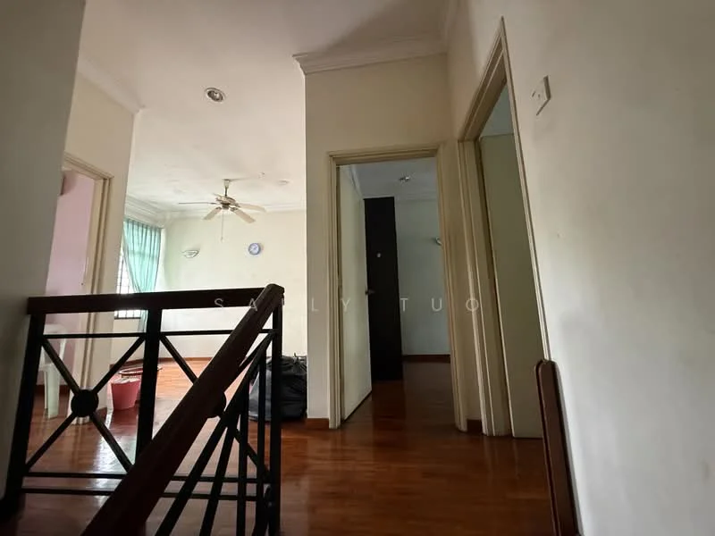 Room features: cream painted walls, wooden flooring, ceiling fan, doorway leading to other rooms, natural light from windows, light fixture on ceiling, baseboards, window treatments, stair railing.