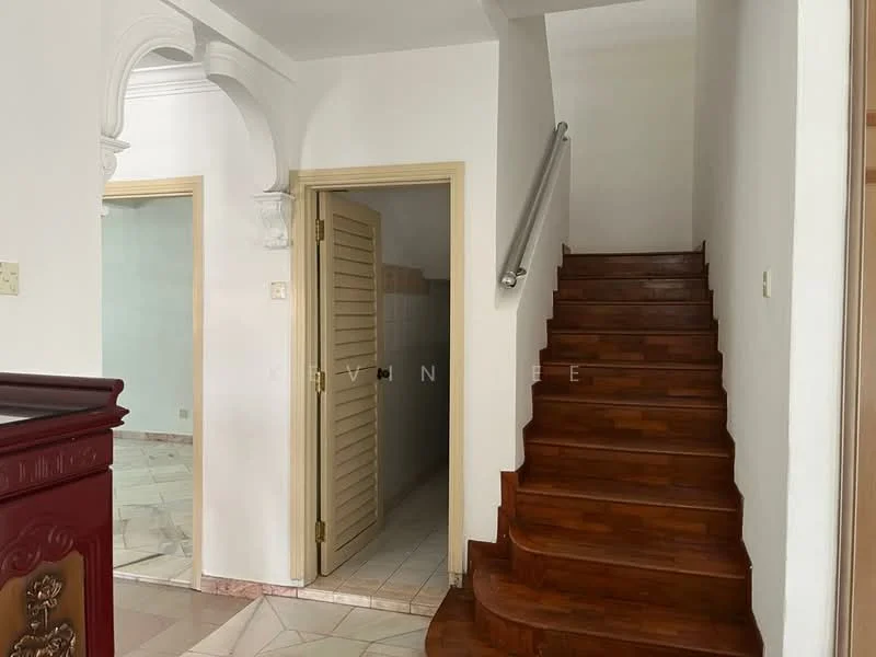Room features: wooden staircase, white painted walls, tile flooring, arched doorway, door with louvered panels, light switch, handrail, corner wall, doorway leading to another room; style: traditional.