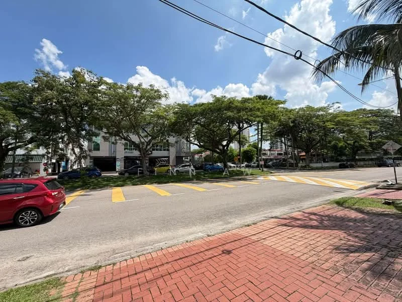 Exterior type: low-rise apartment block; features: paved walkway, manicured lawn, mature trees, street with yellow pedestrian crossing, surrounded by greenery, parking spaces visible; style: modern.