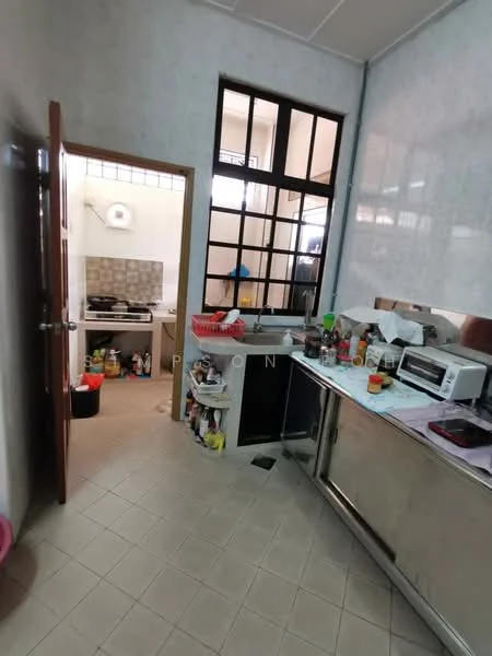 Kitchen features: stainless-steel countertop, white cabinetry, ceramic tile flooring, wall-mounted cabinets, built-in sink, microwave, freestanding stove, window with grid design, open layout to adjacent room, various kitchen appliances, kitchen utensils on countertop, multiple storage containers.