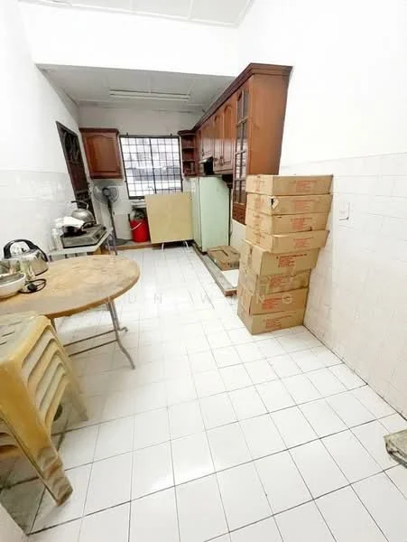 Kitchen features: white tiled flooring, white tiled walls, wooden cabinetry, glass-front upper cabinets, stainless-steel sink, freestanding refrigerator, built-in countertop, round dining table, stacked cardboard boxes, ceiling fan, window with grid, kitchen appliances, open layout.