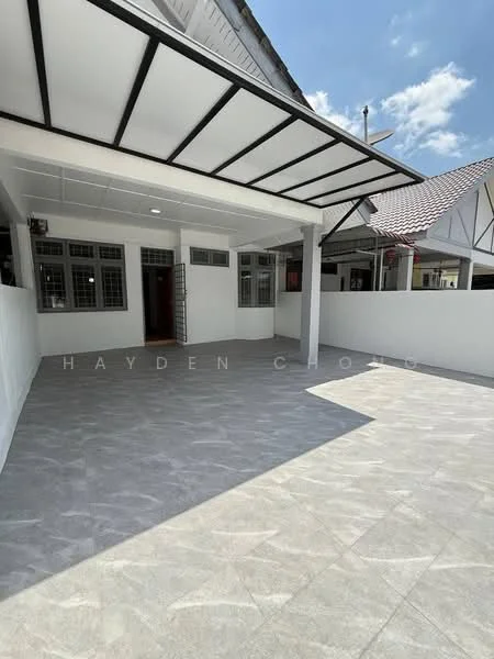 Exterior type: linked terrace house; features: flat roof with overhang, grey tiled flooring, white painted walls, open car porch, surrounded by white boundary wall, large windows, main entrance door visible, natural light from overhead, clear blue sky; style: modern.
