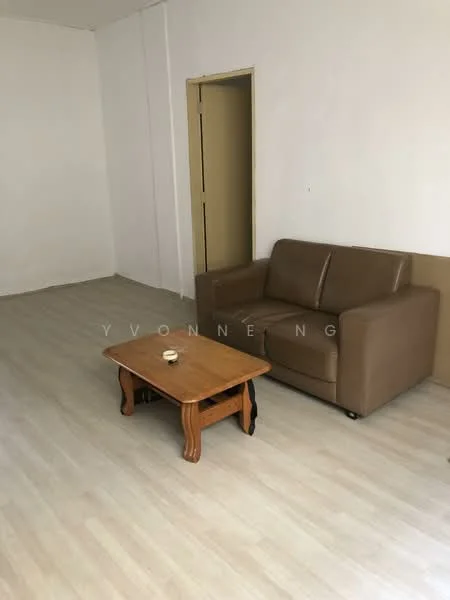 Living features: light wood laminate flooring, white painted walls, brown leather sofa, wood coffee table, empty space, neutral decor, single door leading to another room, natural light from doorway; style: minimalist.