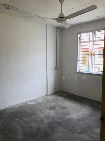 Room features: white painted walls, concrete flooring, ceiling fan, single window, exposed electrical wiring.