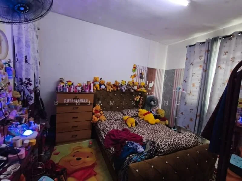 Bedroom features: king-size bed with upholstered headboard, animal print bedding, wooden dresser with multiple drawers, decorative stuffed animals on bed, wall-mounted ceiling fan, curtains with floral pattern, carpeted flooring, decorative wall art, table lamp on nightstand, cluttered bedside table with various items; style: modern.