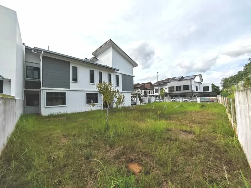 Exterior type: semi-detached house; features: grey and white painted facade, two-storey structure, flat roof, manicured lawn, surrounded by greenery, driveway, adjacent to other residential buildings; style: modern.