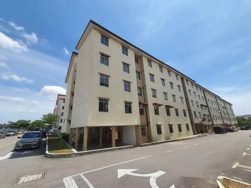 Exterior type: low-rise apartment block; features: cream painted facade, flat roof, approximately 4-storey, parking lot visible, surrounded by greenery, driveway with interlocking pavers; style: modern.