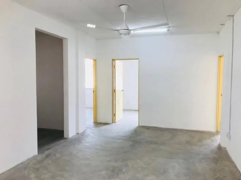 Room features: white painted walls, concrete flooring, ceiling fan, multiple doorways, natural light from windows, plain ceiling, no visible furniture, neutral color scheme; style: minimalist.