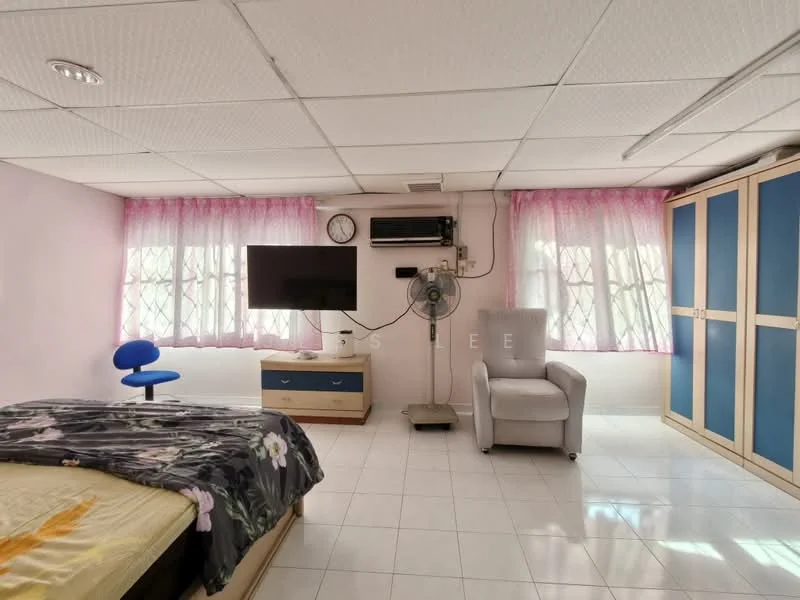 Room features: white tiled flooring, pink curtains, wall-mounted TV, ceiling fan, single bed with floral bedding, wooden bedside table with drawers, blue office chair, grey armchair, built-in wardrobe with blue doors, air conditioning unit; style: modern.