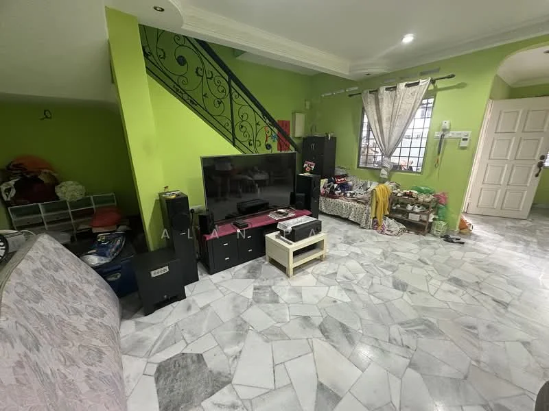 Living features: green painted walls, marble flooring, TV unit, black speakers, sofa, decorative items on shelves, curtains, staircase with decorative railing, coffee table, storage boxes, area rug.