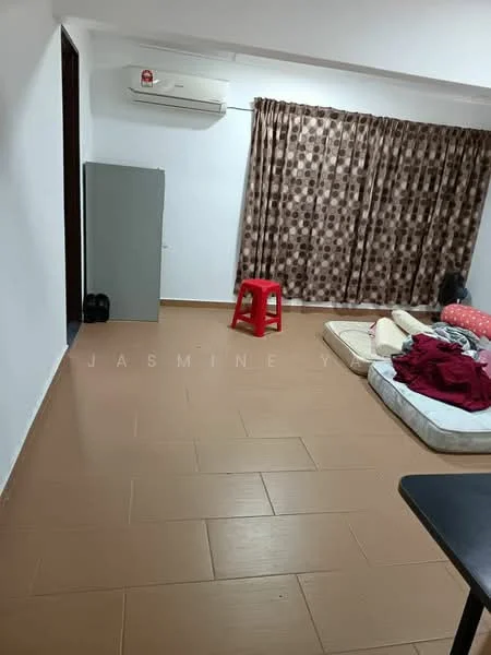Living features: light brown tiled flooring, white painted walls, brown patterned curtains, 1 wall-mounted split AC, red plastic stool, grey cabinet, mattress on the floor, red blanket, black decorative item.