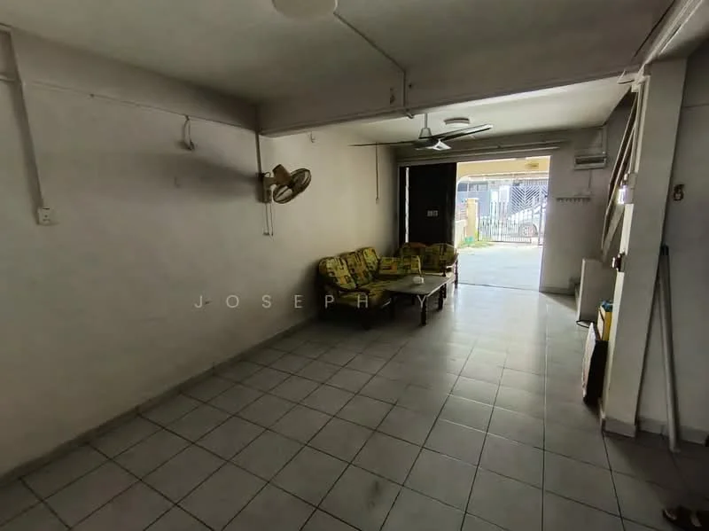Living features: white painted walls, ceramic tile flooring, ceiling fan, 3-seater fabric sofa in green and yellow, coffee table, floor-to-ceiling windows, doorway leading outside, air conditioning unit.