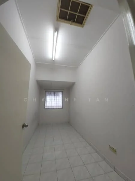 Room features: white painted walls, tile flooring, fluorescent ceiling lights, window with security bars, single door, square layout.