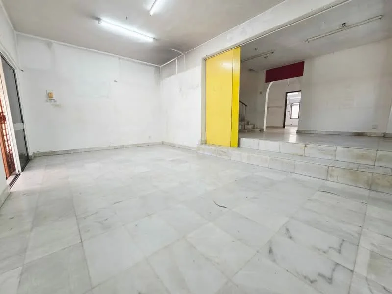 Room features: marble flooring, white painted walls, ceiling lights, steps leading to a raised area, large windows, yellow accent wall, open layout, neutral color scheme; style: minimalist.