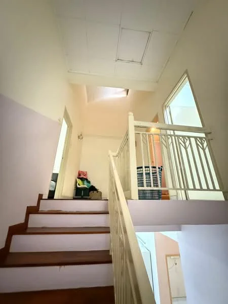 Room features: wooden staircase, white painted walls, skylight, railing with white balusters, laminate flooring, doorways leading to other rooms, natural light from skylight; style: modern.