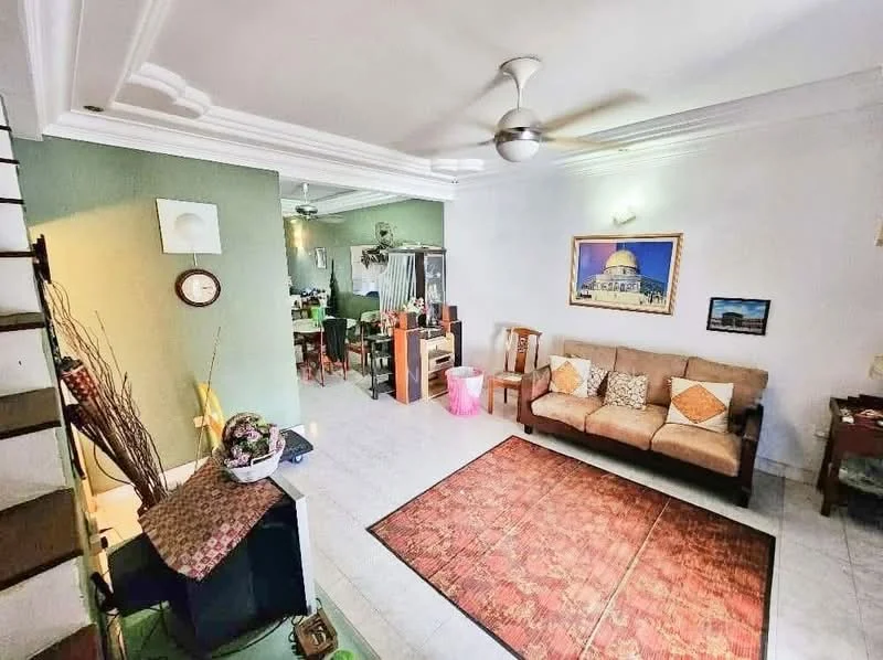 Living features: 3-seater fabric sofa in brown, decorative cushions, area rug with geometric pattern, wall-mounted clock, framed artwork on wall, ceiling fan with light, white painted walls, crown moulding, tile flooring, open layout to dining area; style: contemporary. Dining features: dining table with chairs, open layout to living area, green accent wall, decorative plants, light fixture above table; style: contemporary.