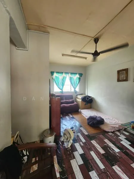 Room features: light-colored painted walls, wooden flooring with patterned tiles, ceiling fan, large window with turquoise curtains, two bean bag chairs, wooden cabinet, mattress on the floor, decorative wall art; style: minimalist.