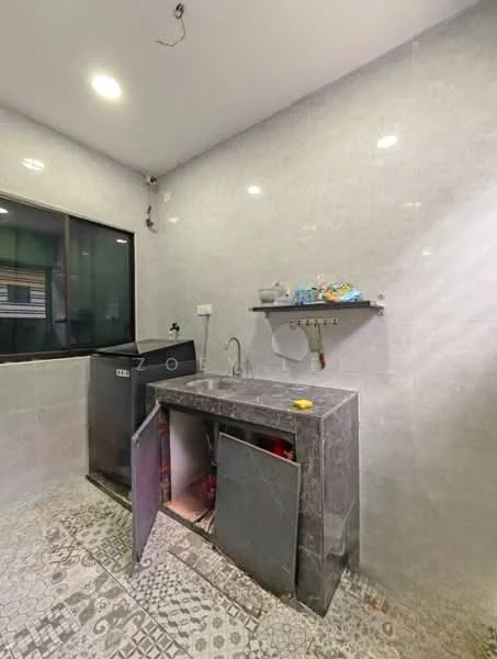 Laundry features: grey tiled walls, grey tiled flooring, single-bowl stainless-steel sink, chrome faucet, built-in cabinet under sink, washing machine, shelf above sink, window for natural light, LED ceiling lights; style: modern.