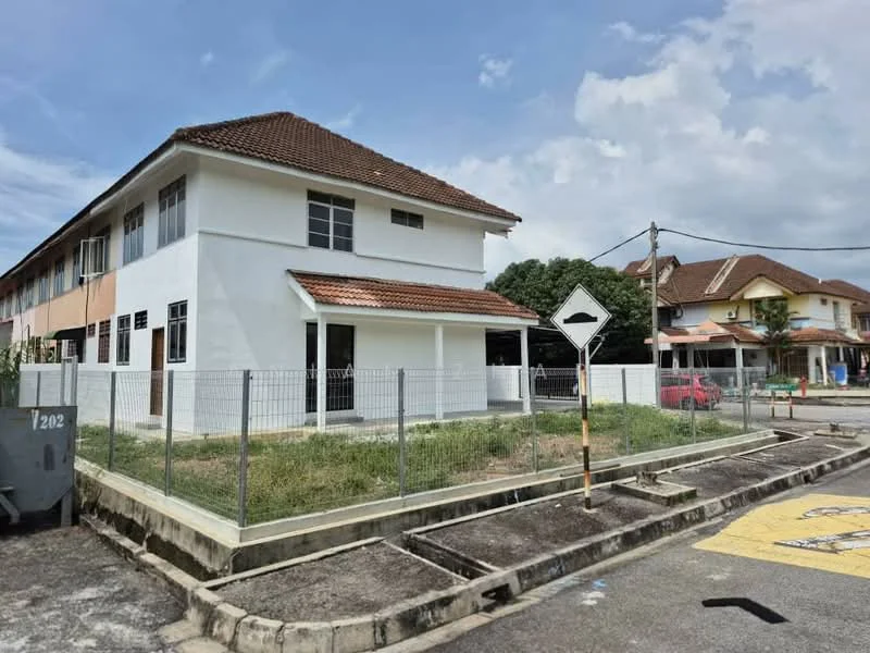 Exterior type: semi-detached house; features: white painted facade, pitched tile roof, two-storey structure, fenced perimeter, manicured lawn, concrete driveway, surrounded by residential neighborhood, adjacent to main road; style: modern.