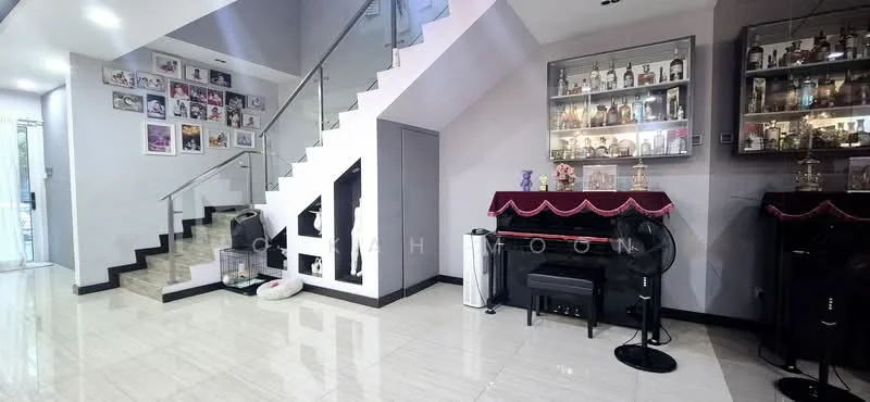 Living features: white painted walls, glossy tile flooring, staircase with glass railing, decorative wall with framed photos, bar cabinet with glass shelves, black piano, two standing fans, decorative table with cloth, recessed lighting, open layout to adjacent area; style: modern.