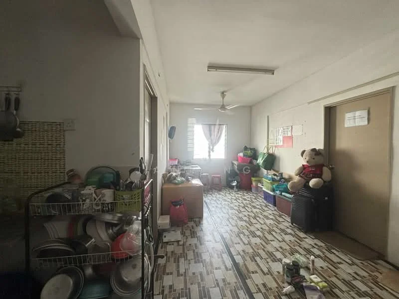 Room features: ceiling fan, tiled flooring with geometric pattern, multiple storage boxes, large teddy bear, kitchenware including plates and bowls, window with sheer curtains, door leading to another room, wall-mounted hooks, various bags and containers.