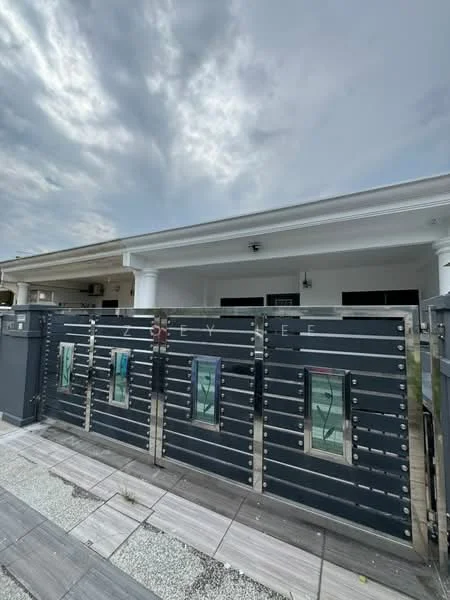 Exterior type: detached bungalow; features: modern metal gate with glass inserts, white painted facade, covered porch area, stone-paved walkway, grey tiled flooring, overcast sky, columns at entrance; style: modern.