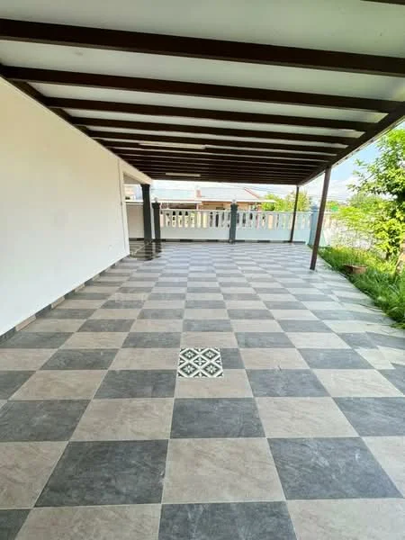 Room features: checkered tile flooring in grey and black, white painted walls, exposed beam ceiling, balcony railing, outdoor view, drainage grate in floor, greenery visible outside; style: modern; view: garden.