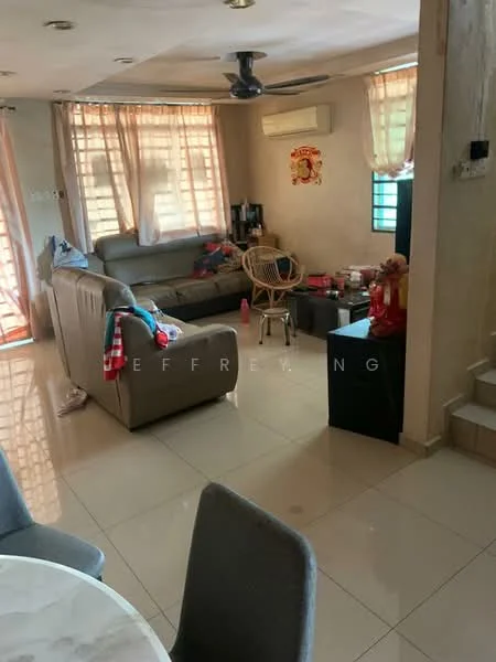 Living features: 3-seater fabric sofa in grey, coffee table, wall-mounted TV, ceiling fan, air conditioning unit, large windows with sheer curtains, tile flooring, decorative wall art, wooden chair, decorative items on the table, light-colored walls.