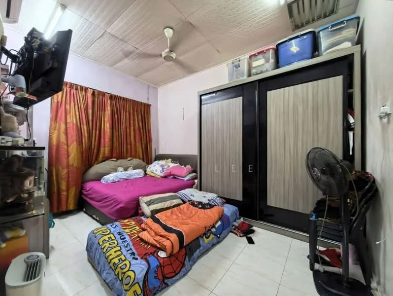 Bedroom features: queen-size bed with pink bedding, single bed with orange and blue bedding, wooden wardrobe with sliding doors, floor fan, ceiling fan, white tiled flooring, curtains with floral pattern, wall-mounted air conditioning unit, decorative wall art, storage boxes on top of wardrobe.