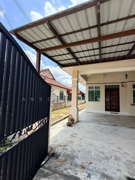 Exterior type: semi-detached house; features: covered car porch, metal gate, concrete flooring, pillar support, flat roof, front yard, visible neighboring houses, outdoor lighting fixture; style: modern.